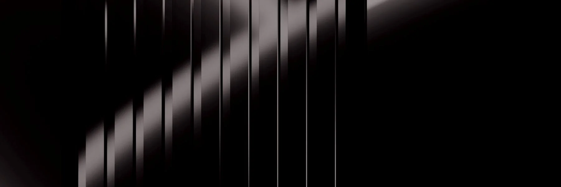 Slats of light crossing a dark room in even intervals